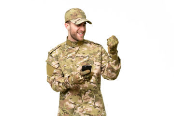 Military man over isolated chroma key background with phone in victory position