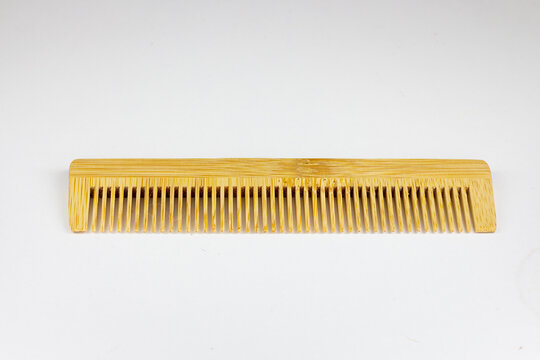 wooden comb isolated on white background, clipping path, close up