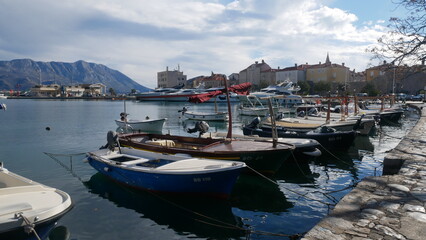 Fototapeta na wymiar Boats at the pier. Small boat on the seashore. Recreation boat. Boat for a sea trip. fishing boat