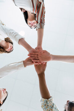 United business team stacking hands