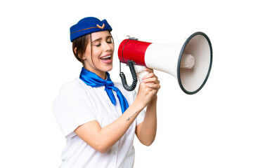 Airplane stewardess over isolated chroma key background shouting through a megaphone