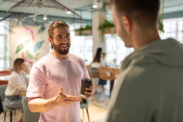 Cheerful client talking with barista