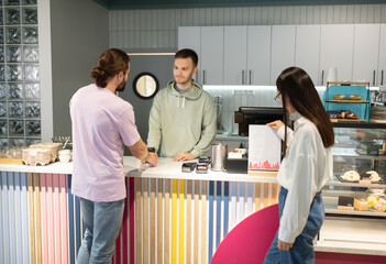 Man taking order in cafe