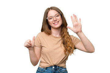 Young pretty woman over isolated background counting six with fingers