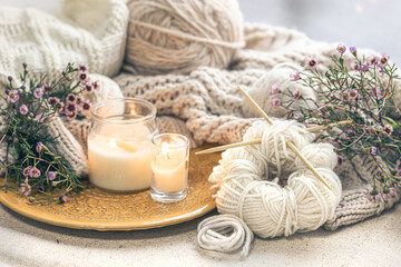 Obraz na płótnie Canvas Cozy home composition with threads for knitting.