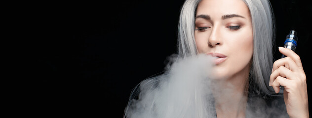 Vaping girl. Silver haired woman blowing a big smoke cloud. Female with an Electronic Cigarette...