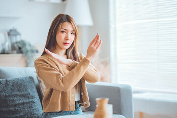 Young asian beautiful woman shows no hands, say no in stop gesture oppose against various violence....
