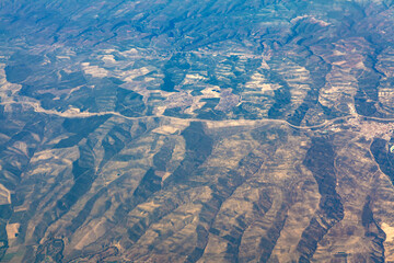 Mountainous terrain view from above . Flight over the mountains 