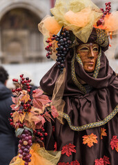 People wearing colorful masks and costumes during the Venice Carnival