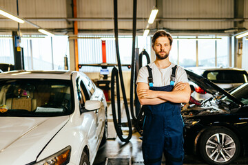 Fototapeta na wymiar Garage service auto shop. Portrait of mechanic in workshop Owner small business.