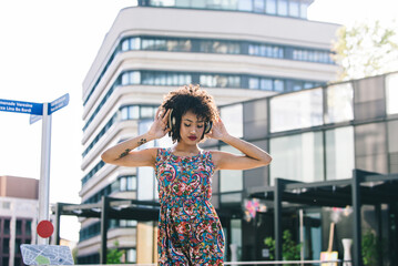 Beautiful afro-american girl with afro hairstyle and stylish clothing