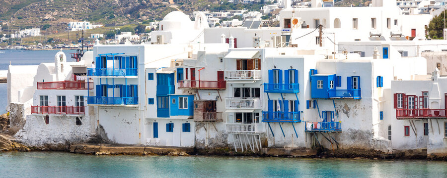 Mykonos, Greece banner panorama of Little Venice white traditional houses aerial view