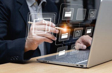 Businessman using laptop for document management, online document database concept and digital file storage or record keeping software, database technology, file access, document sharing.
