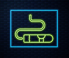 Glowing neon line Cigar icon isolated on brick wall background. Vector