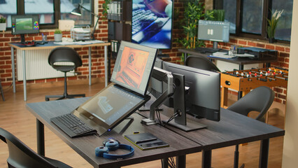Creative agency office with monitors to work on development and engineering interface with cad...
