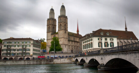 Fototapeta na wymiar Grossmunster Church, Limmat river, Zurich, Switrzerland