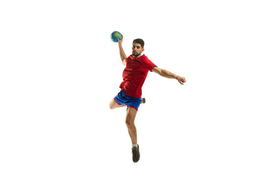 Strength. Dynamic studio shot of professional male handball player in motion training, playing isolated over white studio background. Concept of sport, action, motion, championship, sportive lifestyle