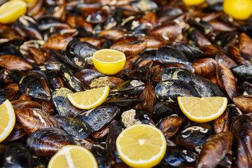 Mussels and lemons. Fresh steamed delicious seafood cuisine. Appetizer