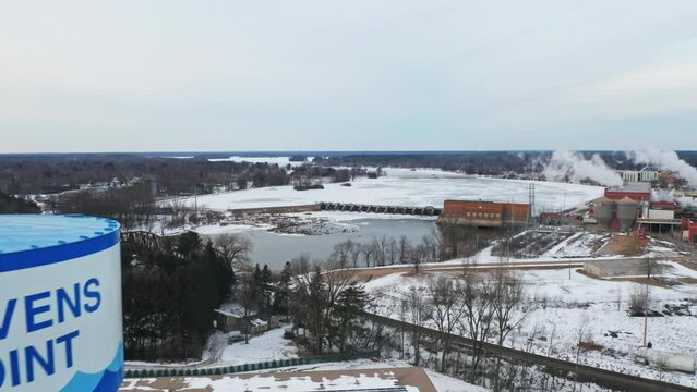 Aerial, Stevens Point water tower during winter season, frozen Wisconsin river