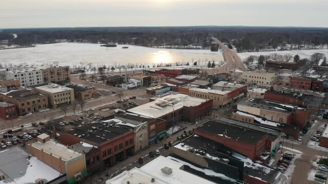 Aerial, empty downtown Stevens Point during winter season. Frozen Wisconsin River