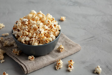 Homemade Kettle Corn Popcorn with Salt in a Bowl, side view. Copy space.