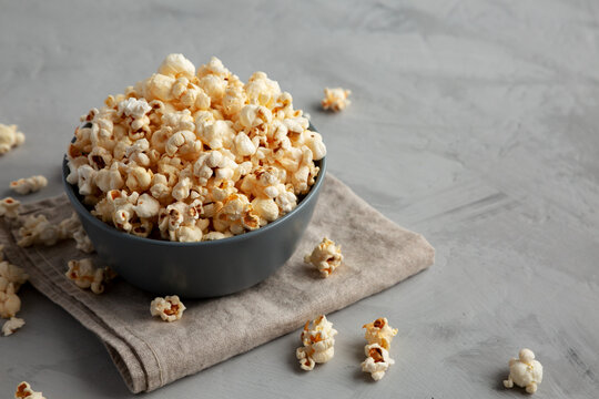 Homemade Kettle Corn Popcorn with Salt in a Bowl, side view. Copy space.