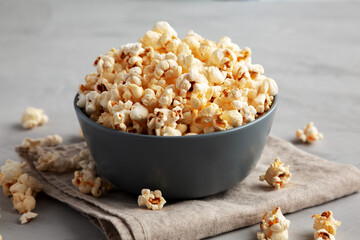 Homemade Kettle Corn Popcorn with Salt in a Bowl, side view.