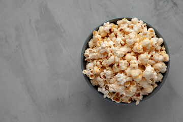 Homemade Kettle Corn Popcorn with Salt in a Bowl, top view. Flat lay, overhead, from above. Copy space.