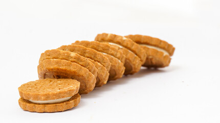 Fototapeta na wymiar biscuit sandwich cookies, baked biscuits stuffed with milk cream isolated on white background