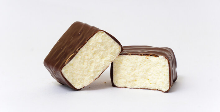 Chocolate Protein bar filled with coconut cream, on a white background