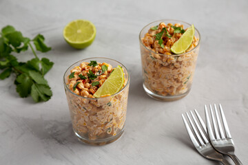 Homemade Mexican Corn Elote Esquites in Cups, side view.
