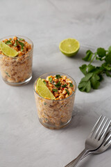 Homemade Mexican Corn Elote Esquites in Cups, side view.