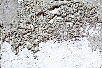 background of a gray uneven concrete wall with white plaster, horizontal
