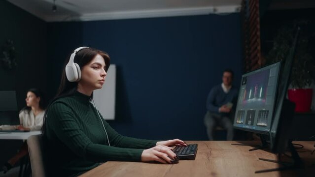 video making studio, post-production processes, woman work with computer, final cut and sound design