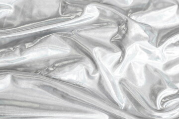 Silver gray silk fabric textile texture background. 