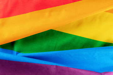 Gay pride flag. LGBTQ rainbow textile texture, overhead flat lay shot. The concept of equality and diversity