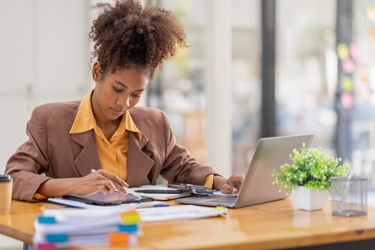 businesswoman analyzing statistics on laptop screen, working with financial graphs charts online, african american woman using business software for data analysis and project management concept, 