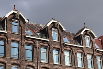 Fototapeta na wymiar Amsterdam Van Barlestraat Street Building Facade with Grey Sky Close Up, Netherlands