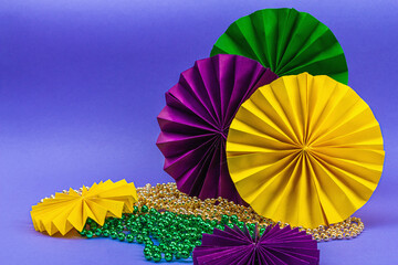 Festive Mardi Gras masquerade violet background. Fat Tuesday carnival, masks, beads, traditional...