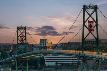 Angus L. Macdonald Bridge at dusk. It connects Halifax and Dartmouth, Nova Scotia. - 568739223