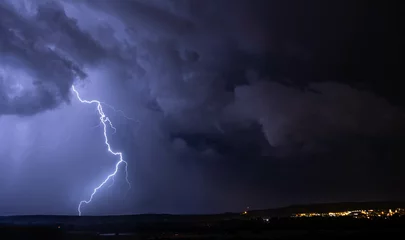 Fotobehang Electric storm and lightning on landscape © IthiriaSoler