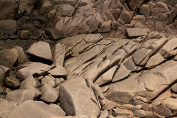 rocks on a beach on a bright and sunny day