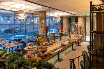 Restaurant interior with food buffet table