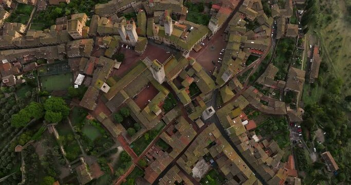 Traditional Italian Town Roofs And Houses In San Gimignano,Tuscany, Italy - aerial top down