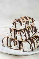 butter cookies dessert covered in chocolate and walnut glaze on gray table