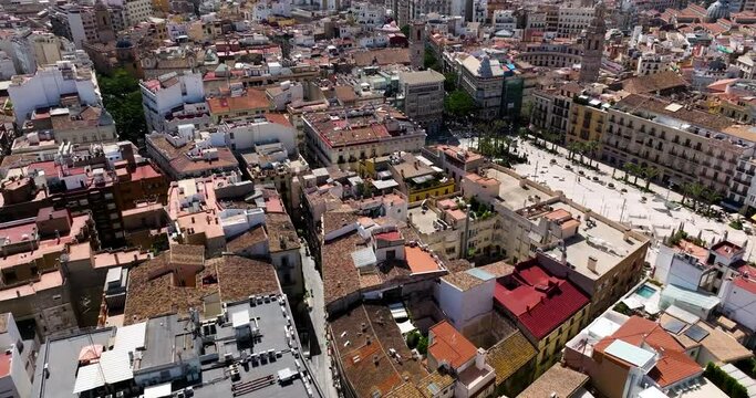 Flying On The Cityscape With Plaza de la Reina Central Plaza In Valencia, Spain. Aerial Drone Shot