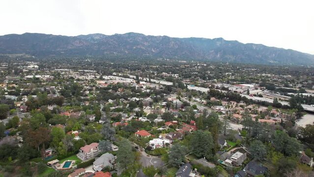 Establishing shot above Pasadena neighborhood with mountain in the background, California