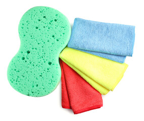 Sponge and car wash cloths on white background, top view