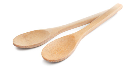 Two new wooden spoons on white background