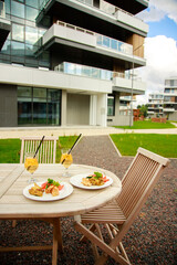 Italian refreshing cocktails with snacks on the table on a summer evening